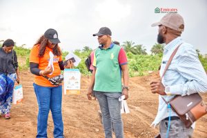 people standing on a plot of land